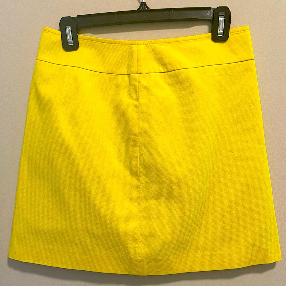 Miniskirt w/back zipper. Yellow, lined, high quality. Perfect for summer.